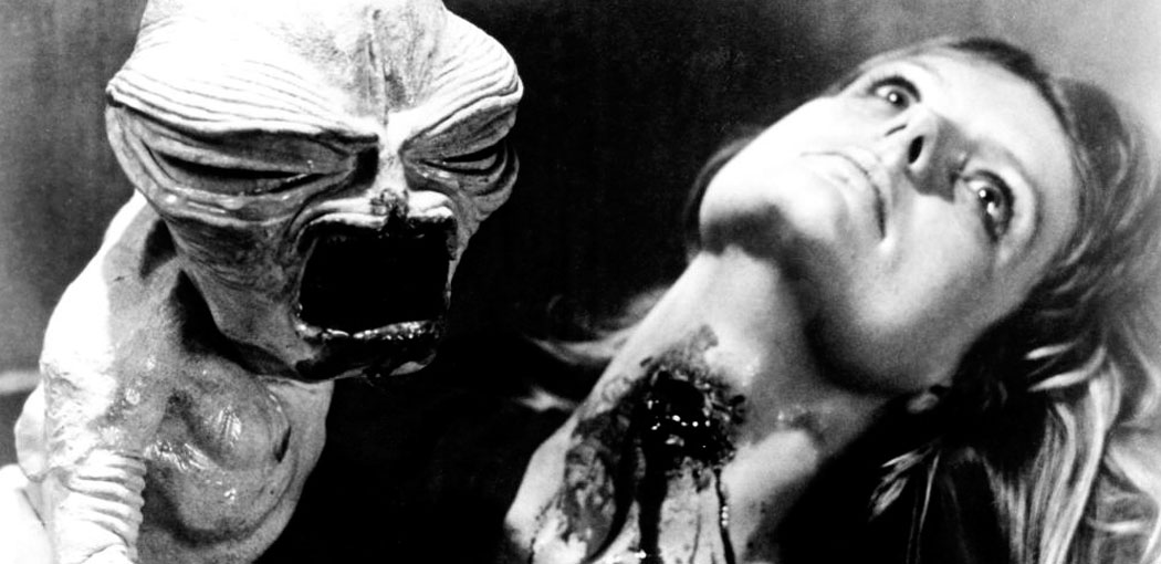 INSEMINOID Alien (aka: Horror Planet), alien vampire baby creature attacking, Heather Wright, 1981. (c)RKO